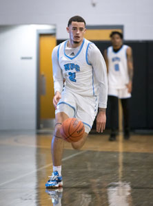 Dribbling down court, Anthony Swift.