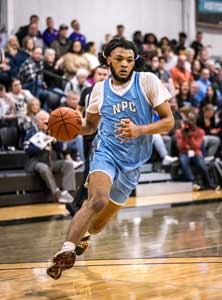 Dribbling down court is Nakavieon White.