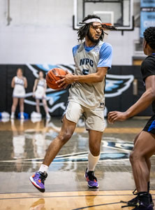 Keeping the basketball from oppenents, Nakavieon White.